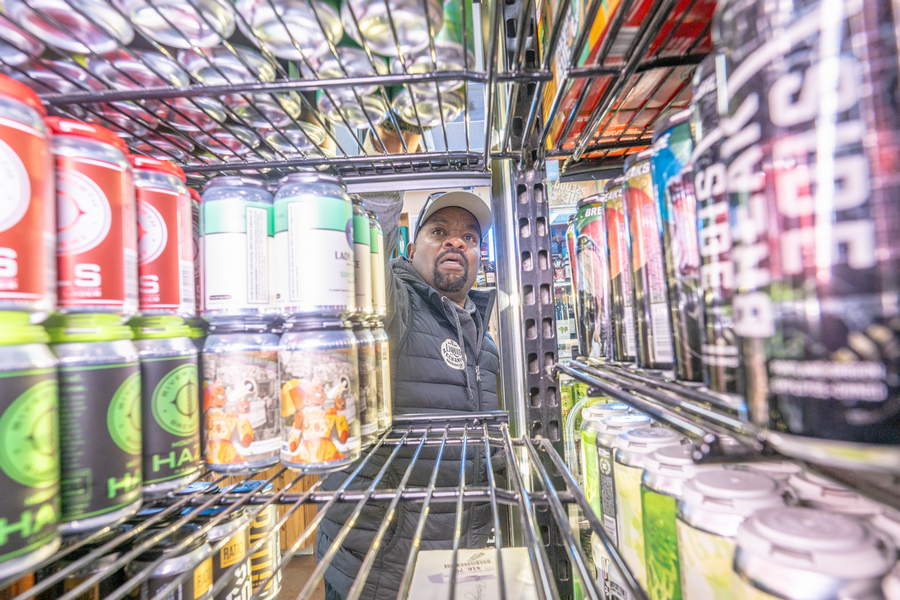 BA reaching for cans